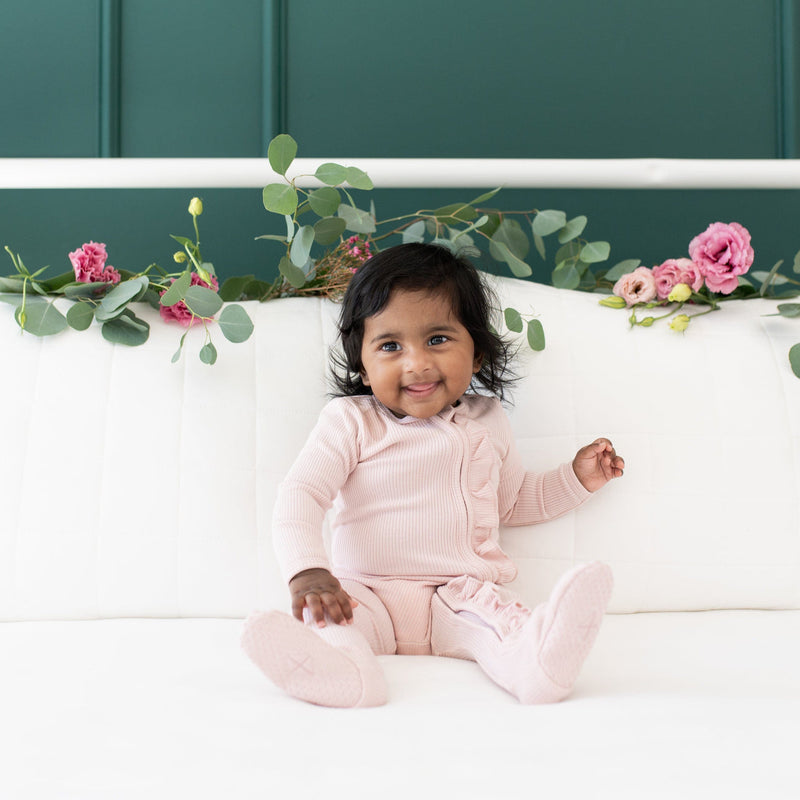 Kyte BABY Ribbed Ruffle Zippered Footie in Blush